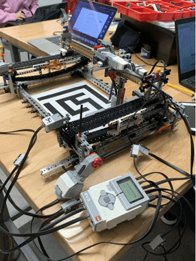 Charlene working in a robotics lab